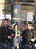 Clan Douglas (image 2) Members of The Caledonian Brewery Pipe Band and Dr.Murray Frick with the Clan Douglas banner