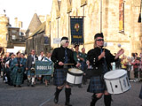 Clan Douglas (image 5) The Caledonian Brewery Pipe Band drummers lead Clan Douglas onto the Royal Mile