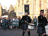 Clan Douglas (image 6) The Caledonian Brewery Pipe Band drummers lead Clan Douglas onto the Royal Mile