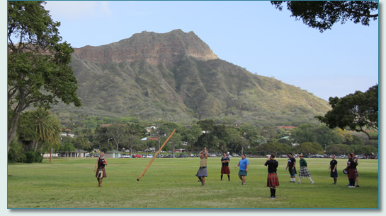 Heavy athletics lads tossing the Caber near Diamond Head, at the Hawaiian Scottish Festival 2013
