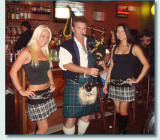 Hamish Burgess with Tia & Alisha, piping for the Bass Brigade St.Patrick's promotion in Honolulu