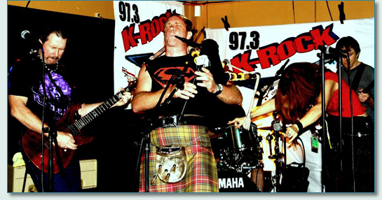 Mad Bagpiper Roger McKinley at Highway to Heal AC/Dcember