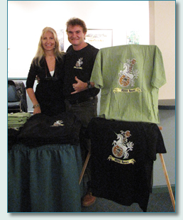 Hamish Burgess and Jennifer Fahrni with his design The Irish Rovers' Unicorn & Mandolin T-shirts
